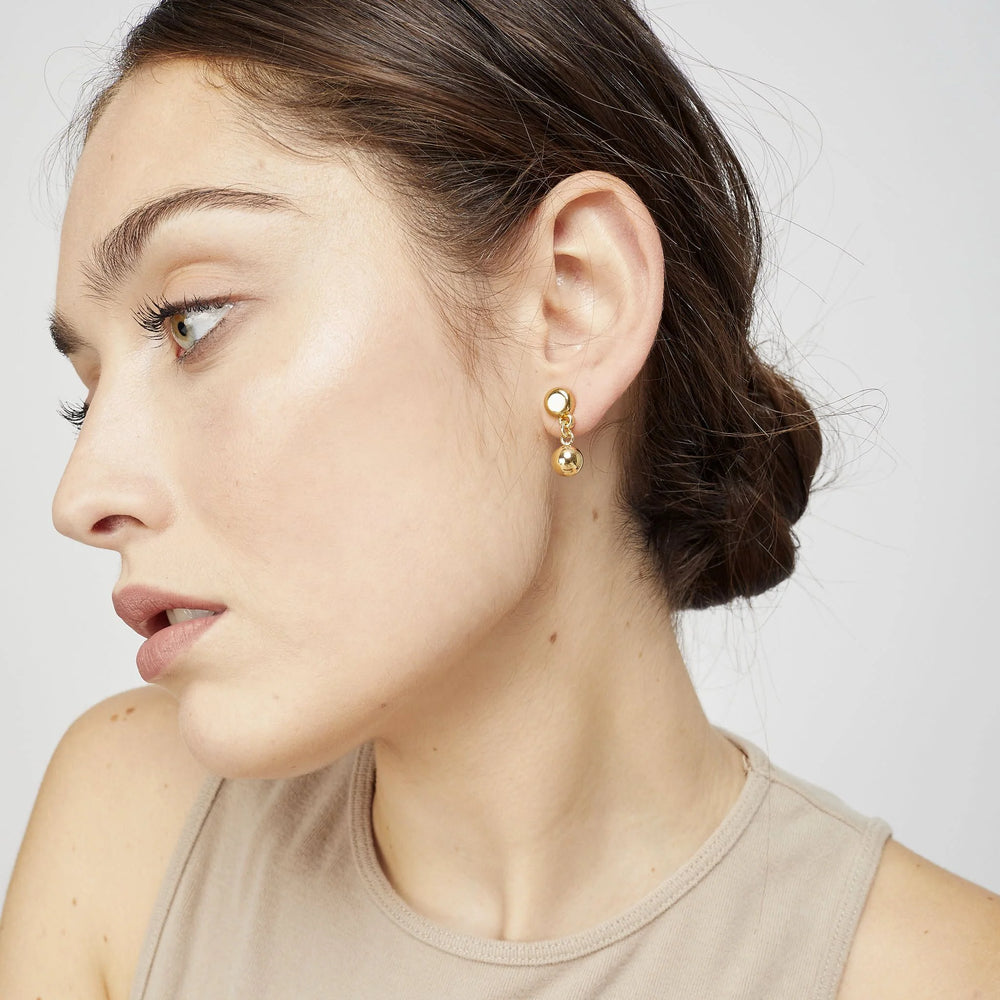 Gold Plated stud earrings with a hanging small round piece