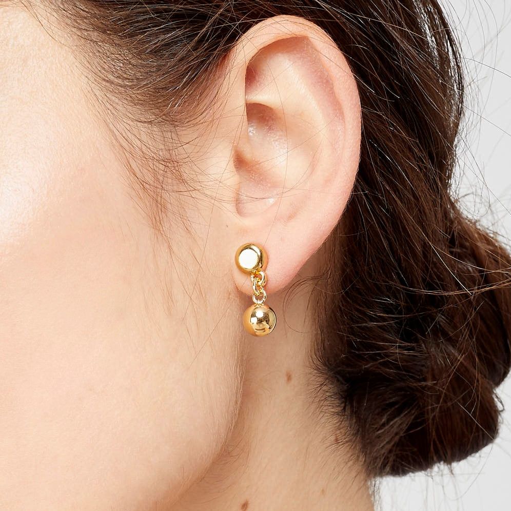 Gold Plated stud earrings with a hanging small round piece